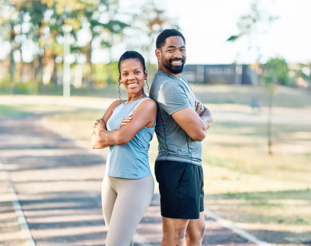 Couple stretching together on a park path